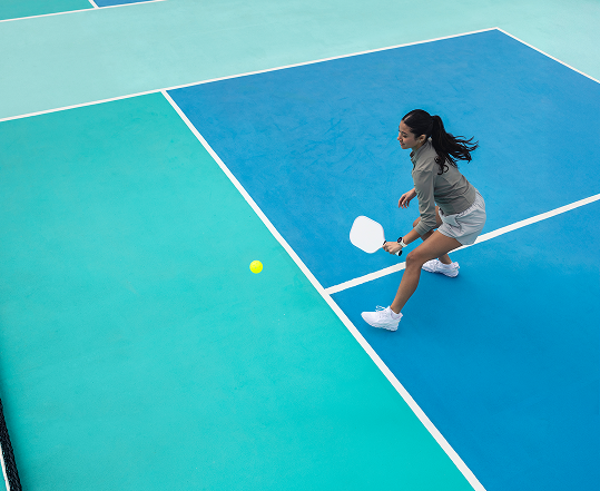 Woman playing pickle ball